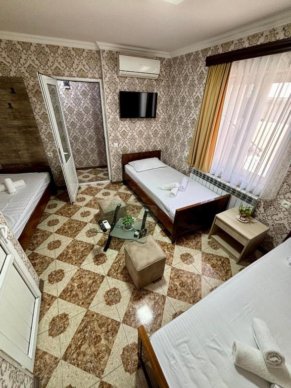 Postel nebo postele na pokoji v ubytování Styopa Hotel