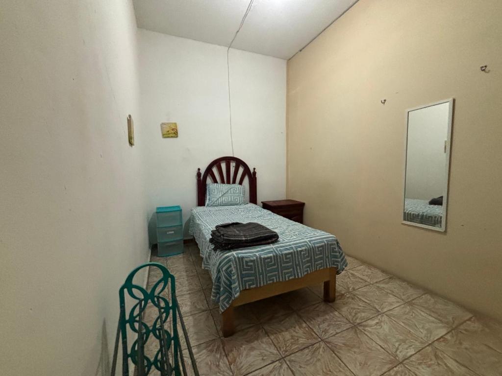 Postel nebo postele na pokoji v ubytování Hostal 509