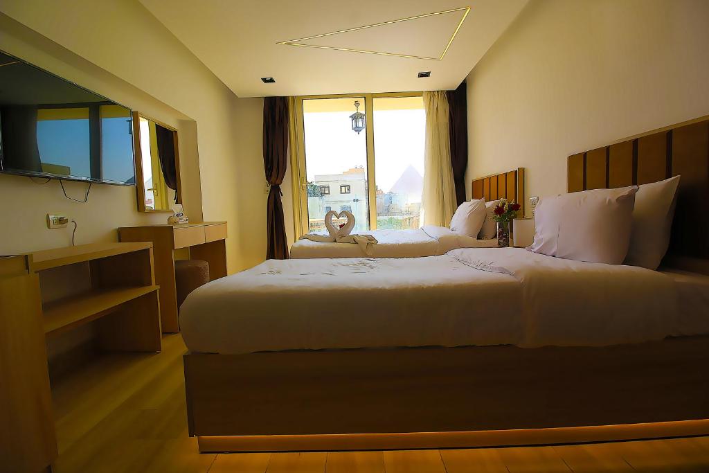 Letto o letti in una camera di The Platinum Pyramid view inn