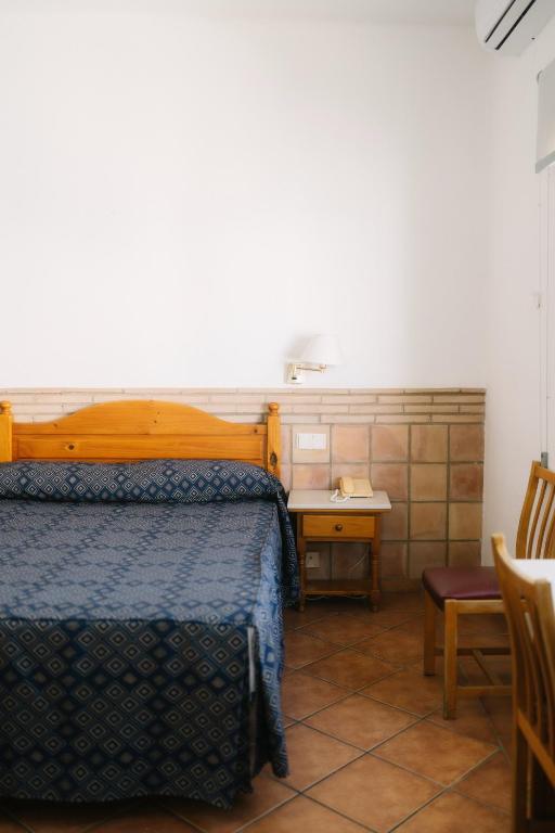 Postel nebo postele na pokoji v ubytování Hotel Can Solé