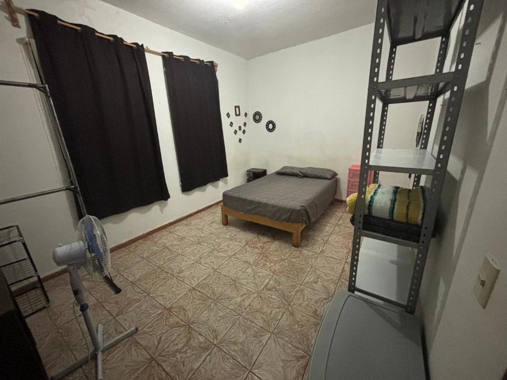 Postel nebo postele na pokoji v ubytování Hostal 509