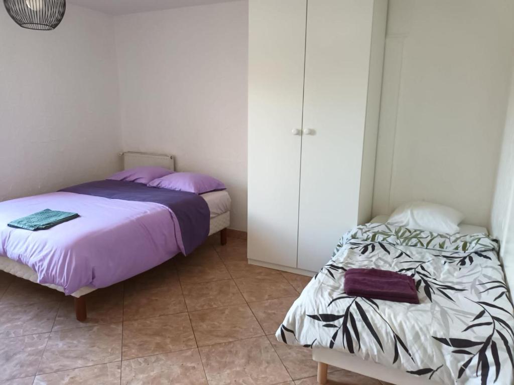 Ένα ή περισσότερα κρεβάτια σε δωμάτιο στο Salon Villepinte, aéroport