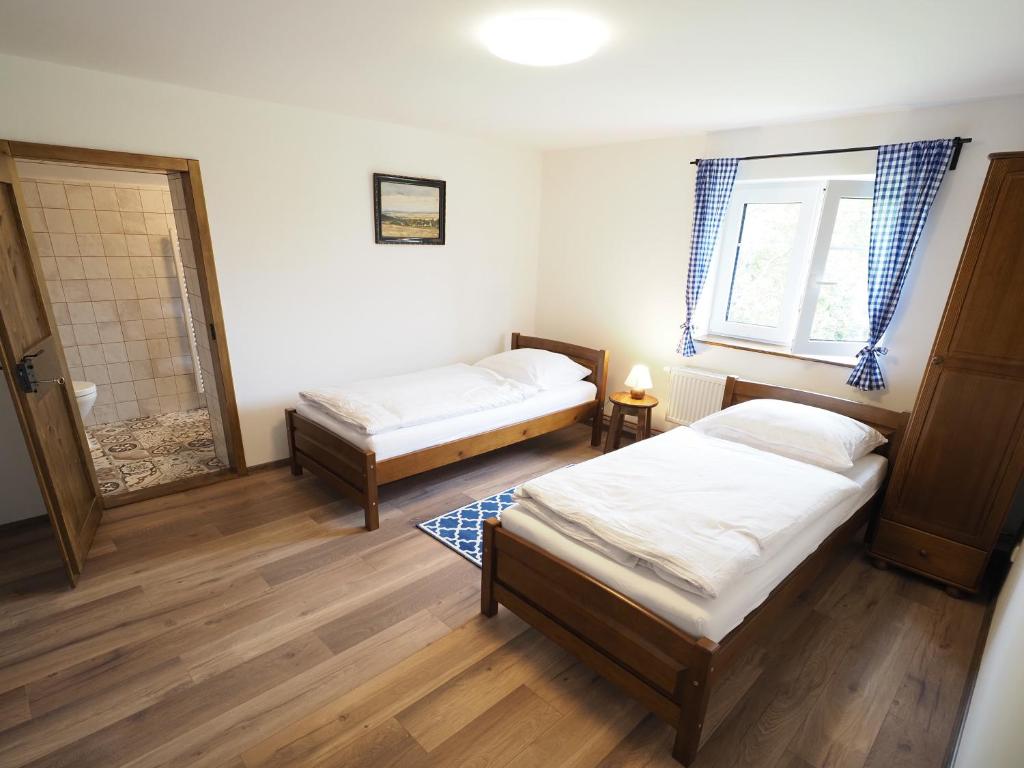 Postel nebo postele na pokoji v ubytování Chalupa U Tří cest