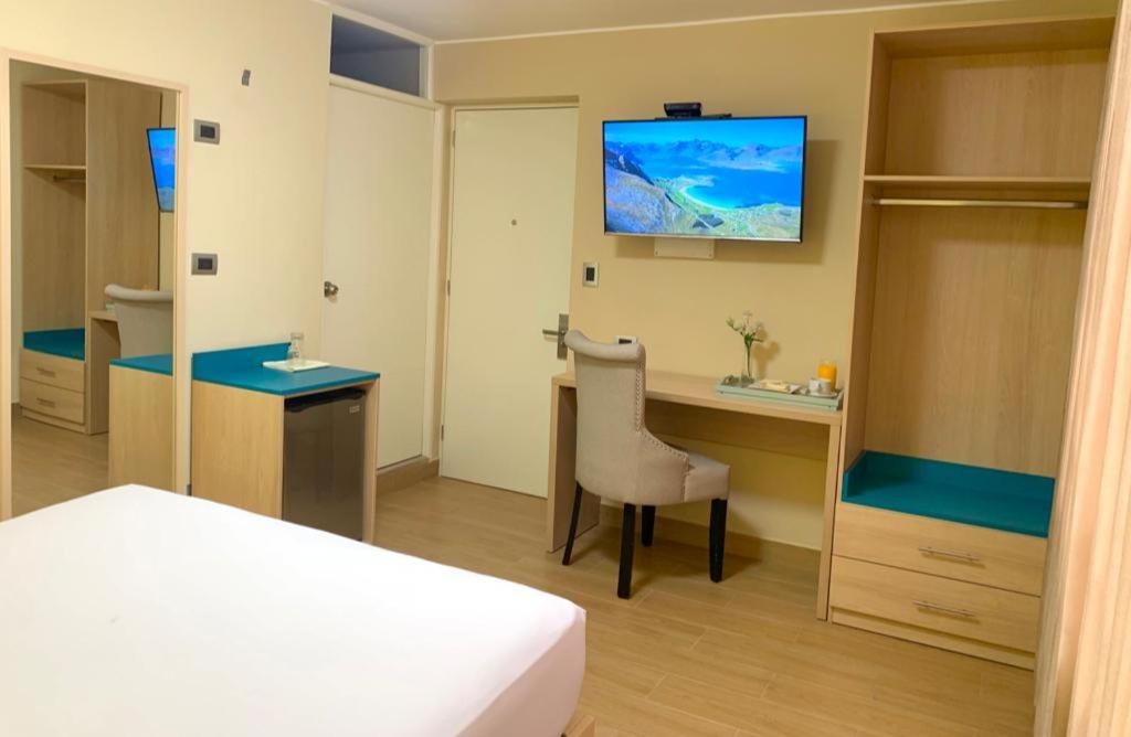 Postel nebo postele na pokoji v ubytování Acuario Hotel & Suite
