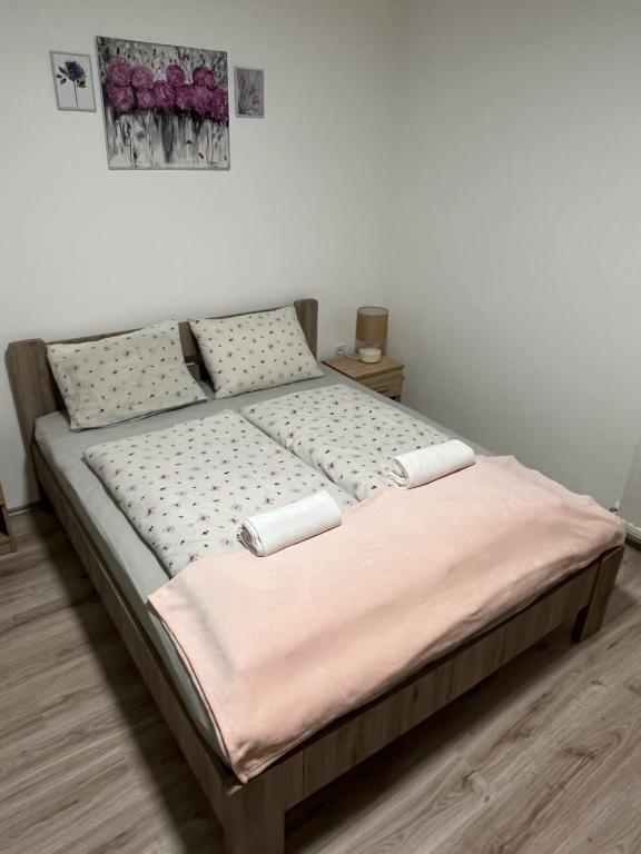 Postel nebo postele na pokoji v ubytování Mini Zoo Apartman