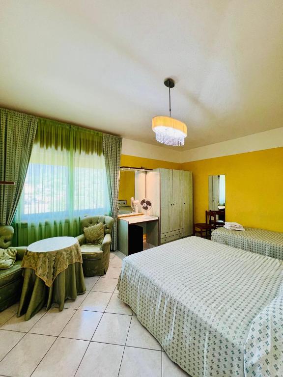Postel nebo postele na pokoji v ubytování Hotel Paradiso