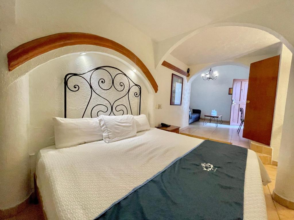 Postel nebo postele na pokoji v ubytování Hotel Frances