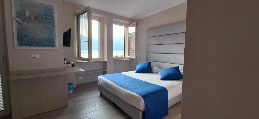 Postel nebo postele na pokoji v ubytování Hotel Danieli La Castellana lago di Garda