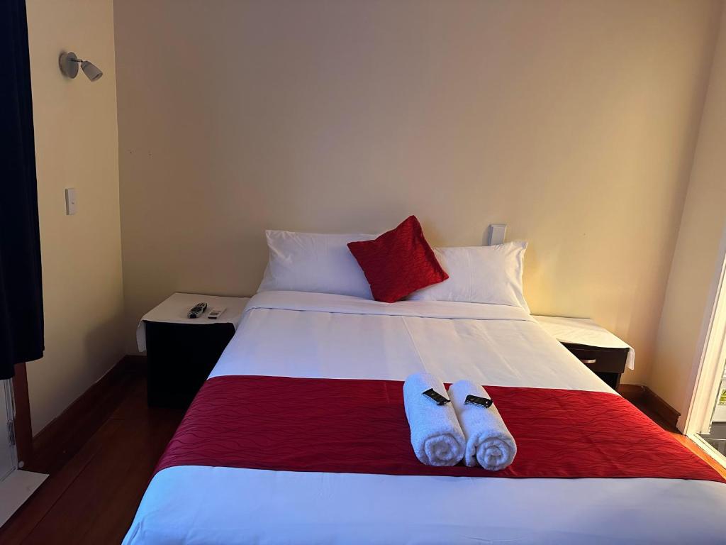 Postel nebo postele na pokoji v ubytování Harrison Motel Papatoetoe