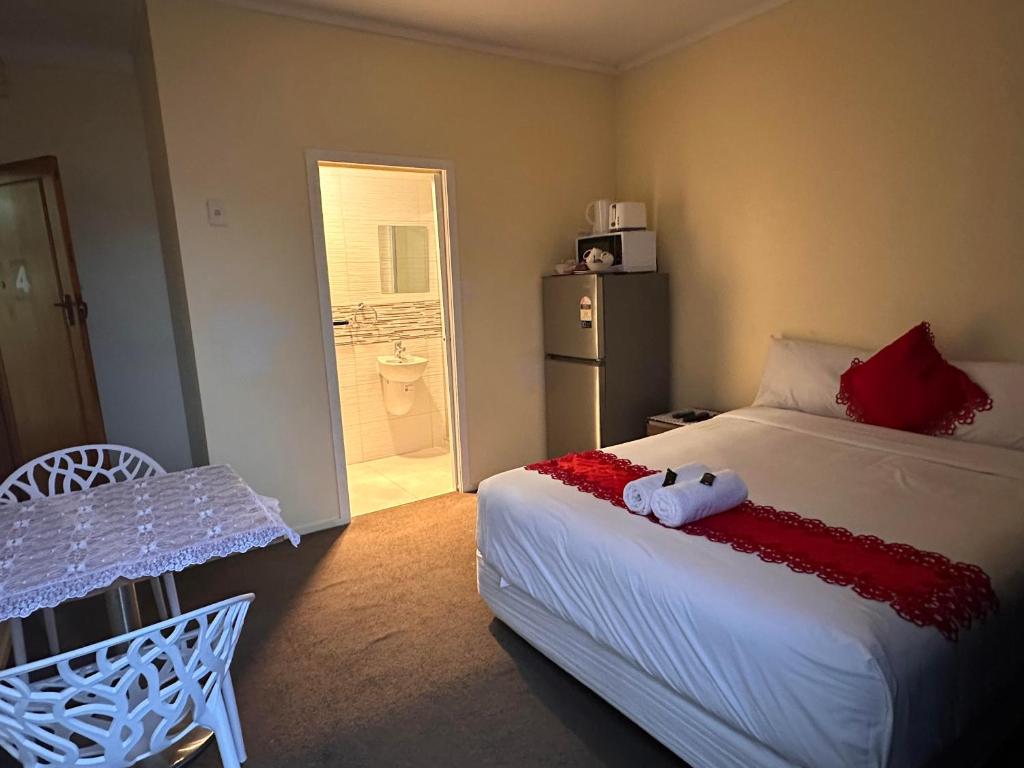 Postel nebo postele na pokoji v ubytování Harrison Motel Papatoetoe