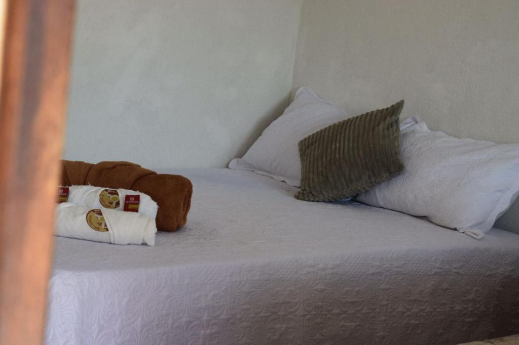 Cama ou camas em um quarto em Pousada Giro das dunas
