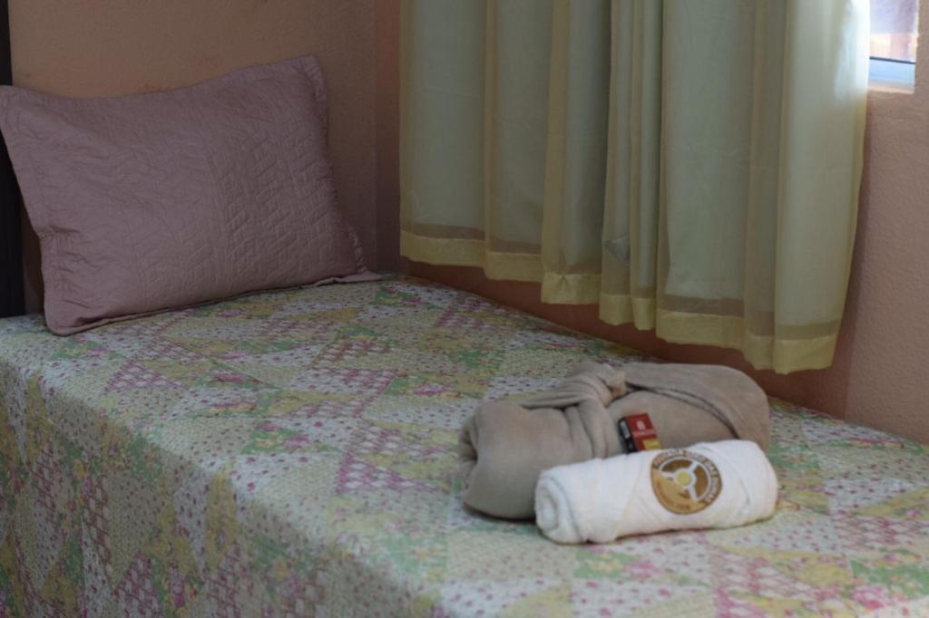 Cama ou camas em um quarto em Pousada Giro das dunas