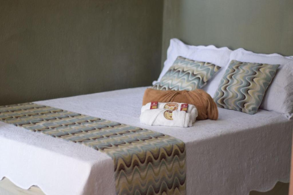 Cama ou camas em um quarto em Pousada Giro das dunas