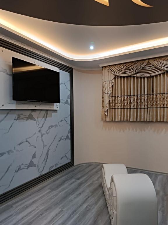 TV a/nebo společenská místnost v ubytování Hostal Kapital City