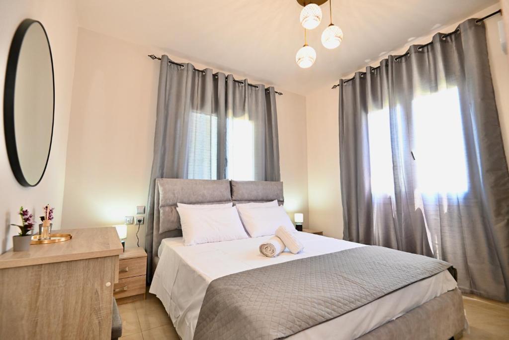 Postel nebo postele na pokoji v ubytování Harmony Garden House