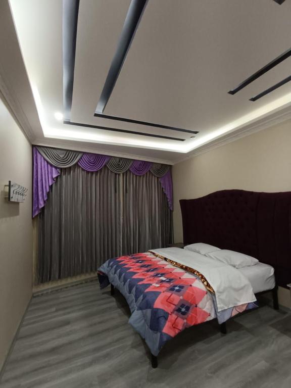 Postel nebo postele na pokoji v ubytování Hostal Kapital City