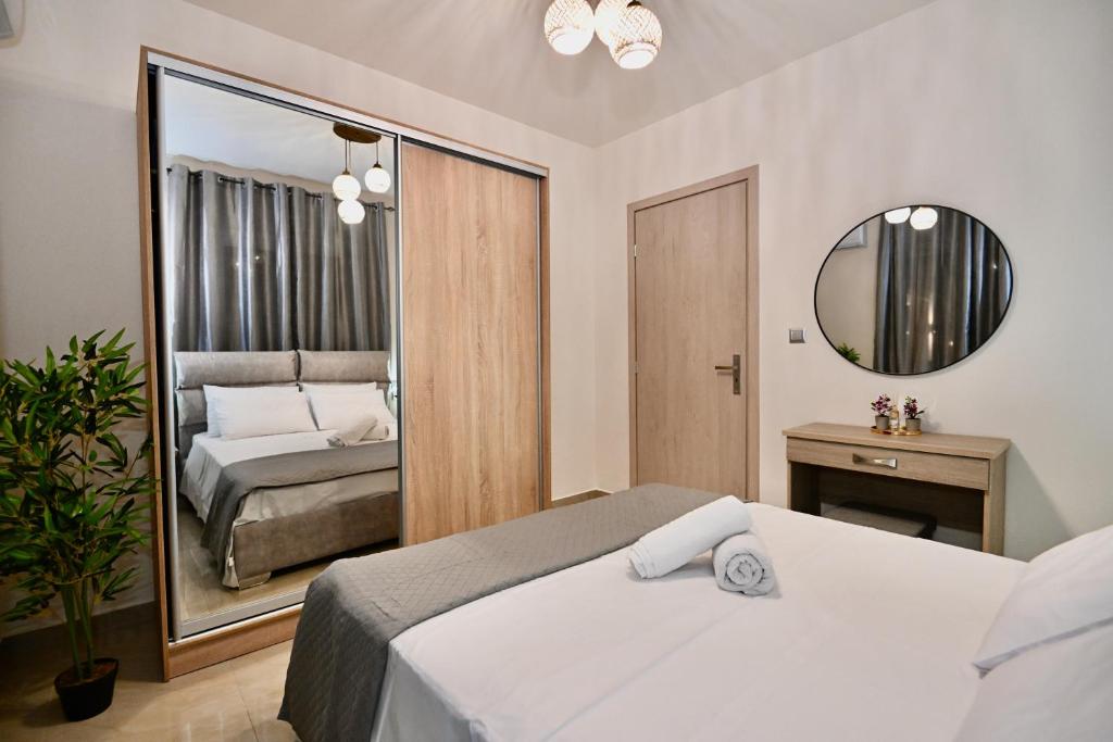 Postel nebo postele na pokoji v ubytování Harmony Garden House