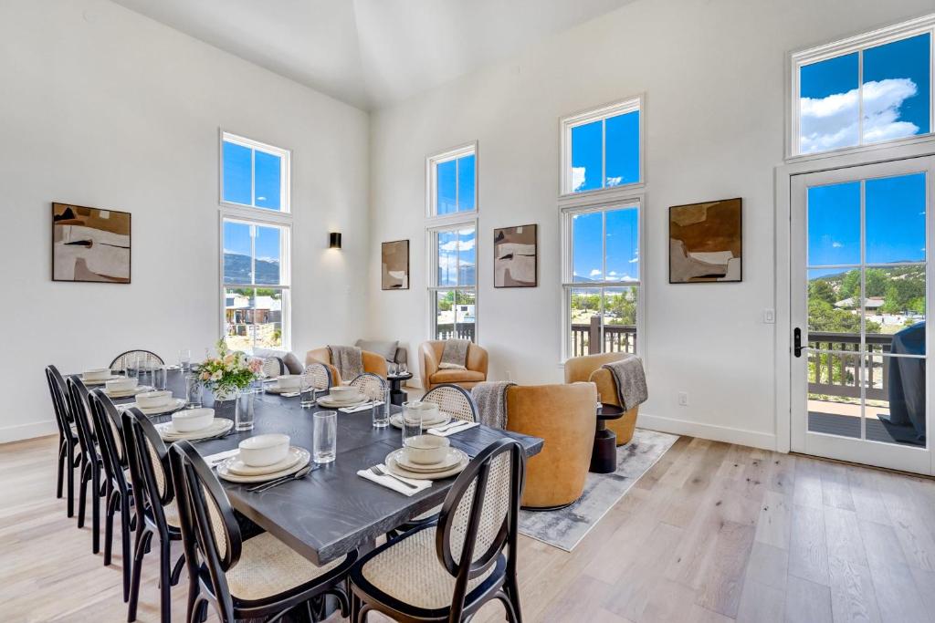 a dining room with a table and chairs at Whitewater Villa - 5BR Luxury Retreat with Hot Tub in Buena Vista