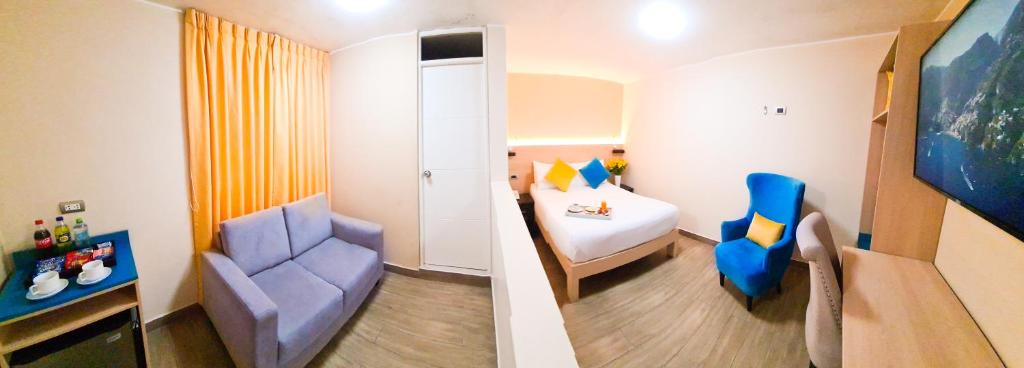 Postel nebo postele na pokoji v ubytování Acuario Hotel & Suite