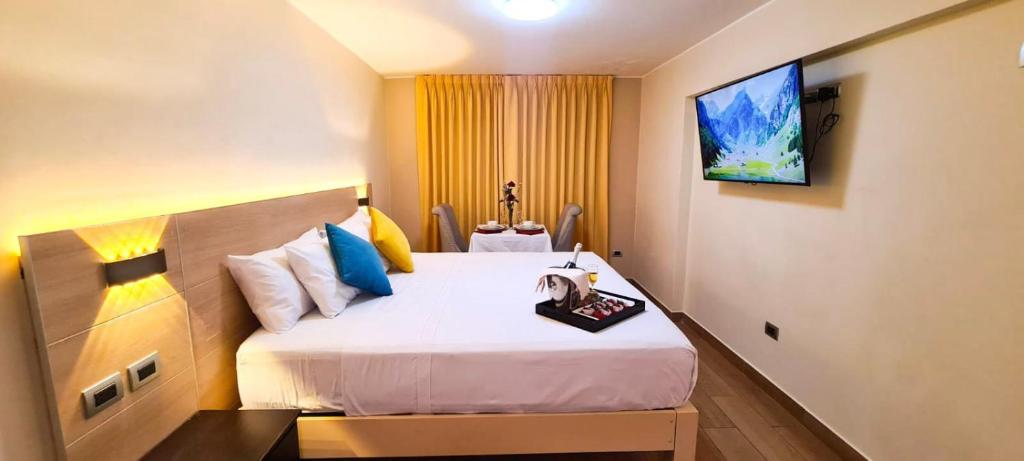 Postel nebo postele na pokoji v ubytování Acuario Hotel & Suite