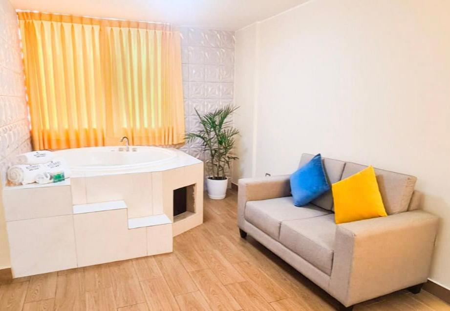 Posezení v ubytování Acuario Hotel & Suite