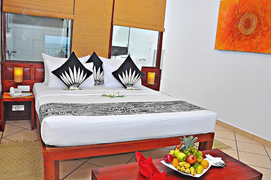 Postel nebo postele na pokoji v ubytování The Long Beach Resort & Spa