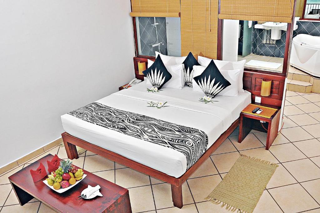 Postel nebo postele na pokoji v ubytování The Long Beach Resort & Spa