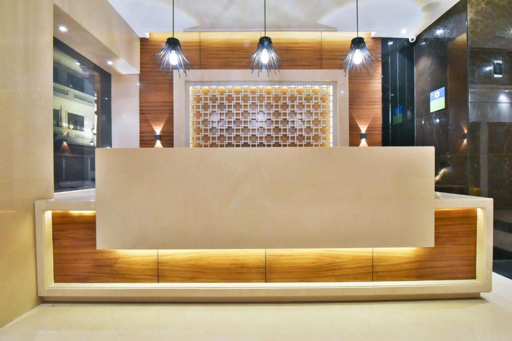 a reception desk in a room with lights at Best Western Summerlea in Jalandhar