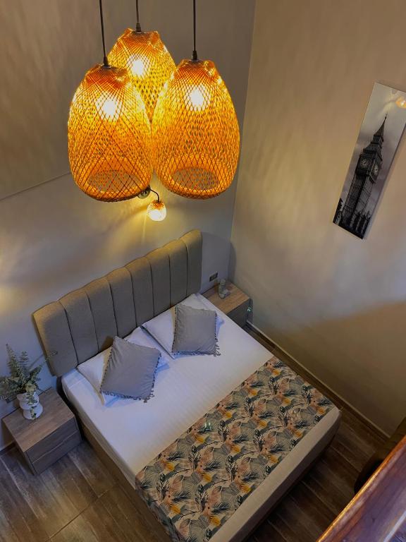 Postel nebo postele na pokoji v ubytování HOTEL BALI AT POBLADO