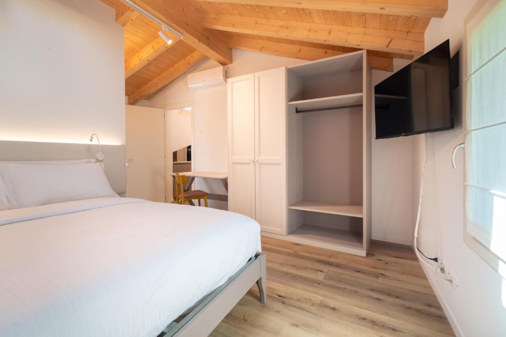Postel nebo postele na pokoji v ubytování BORGO STALIS RESORT