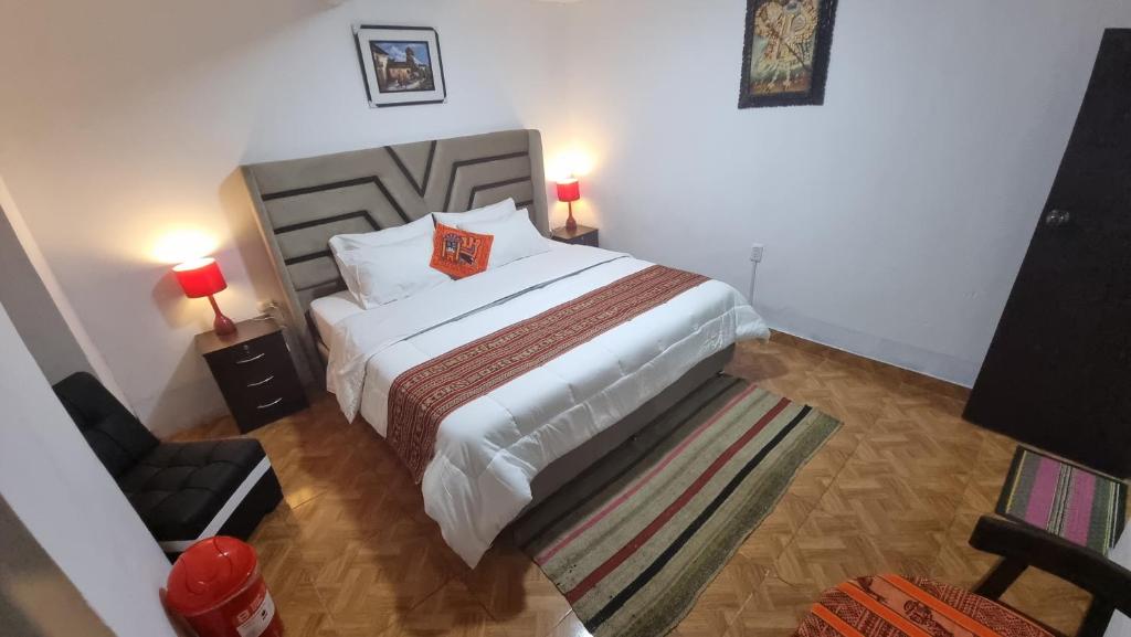 Postel nebo postele na pokoji v ubytování Mallku Wasi - Lodging Hotel Cusco