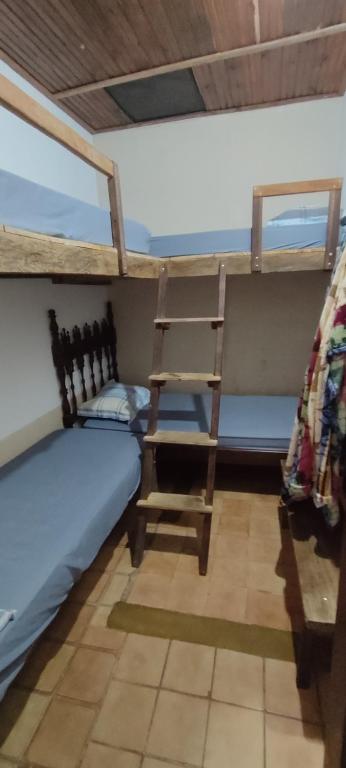 Postel nebo postele na pokoji v ubytování Hostel Mucugê