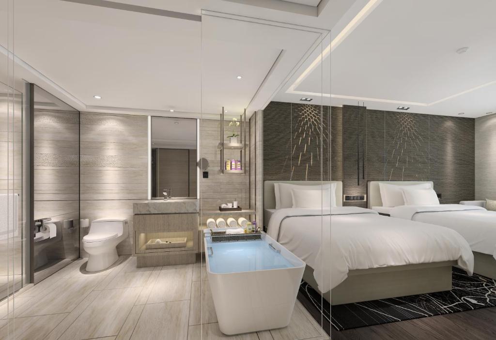 Postel nebo postele na pokoji v ubytování Renaissance Shenzhen Luohu Hotel