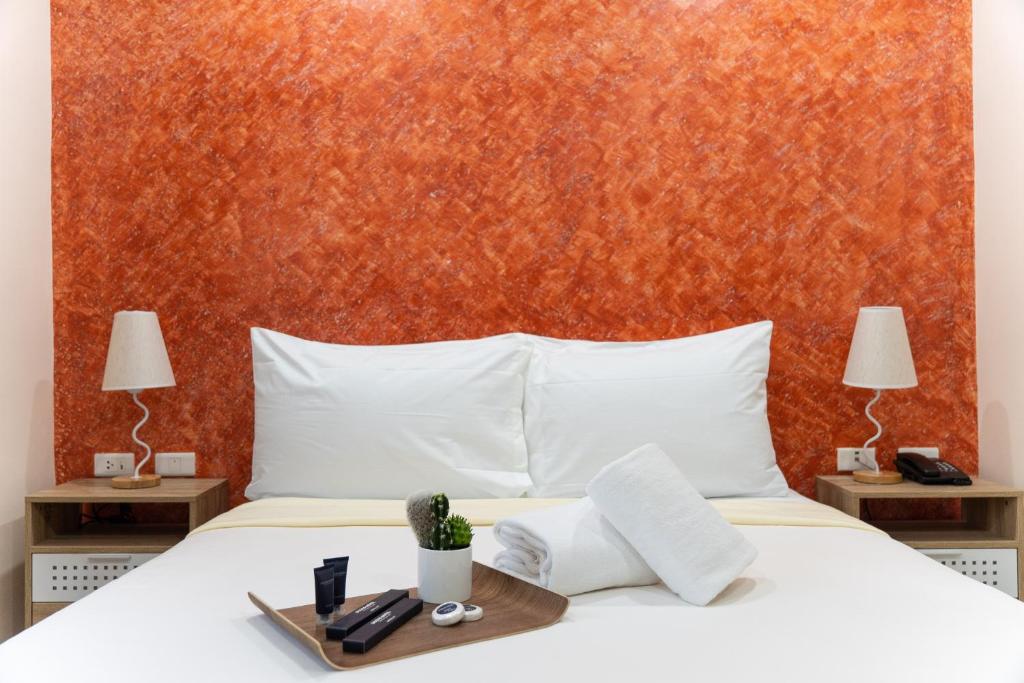 Postel nebo postele na pokoji v ubytování DCCCO Hotel