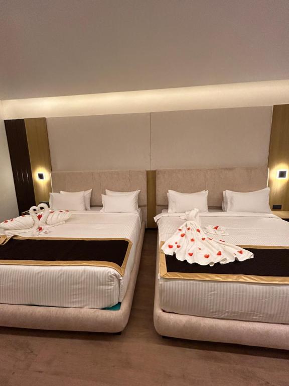 Postel nebo postele na pokoji v ubytování Hotel Oxina Cizel