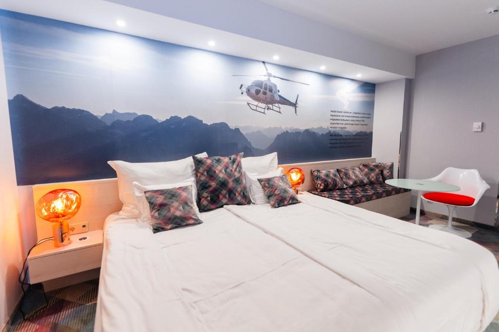 Postel nebo postele na pokoji v ubytování Science Hotel