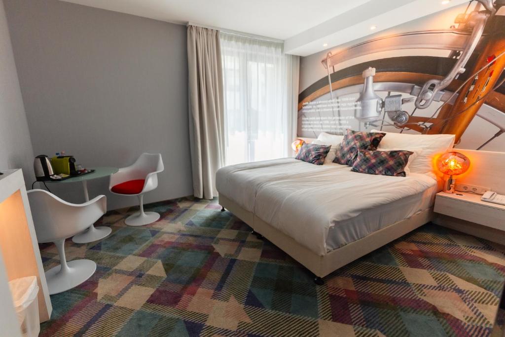 Postel nebo postele na pokoji v ubytování Science Hotel