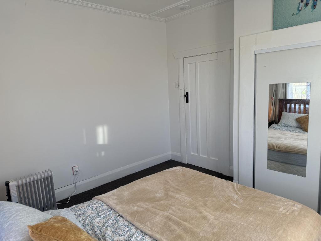 Postel nebo postele na pokoji v ubytování Shazza Homestay