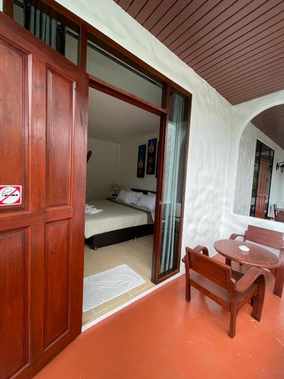 Postel nebo postele na pokoji v ubytování Gee Resort