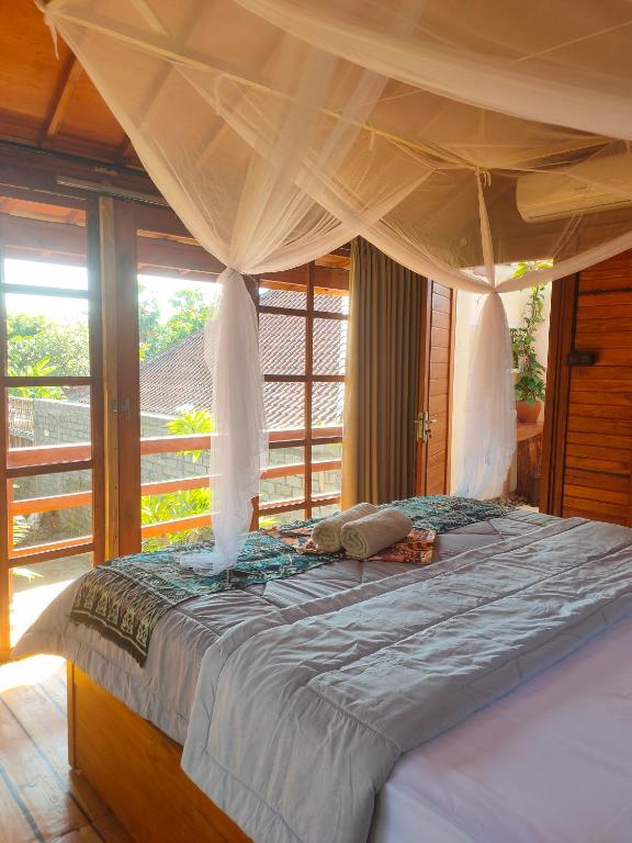 Postel nebo postele na pokoji v ubytování Vanaya Lodge