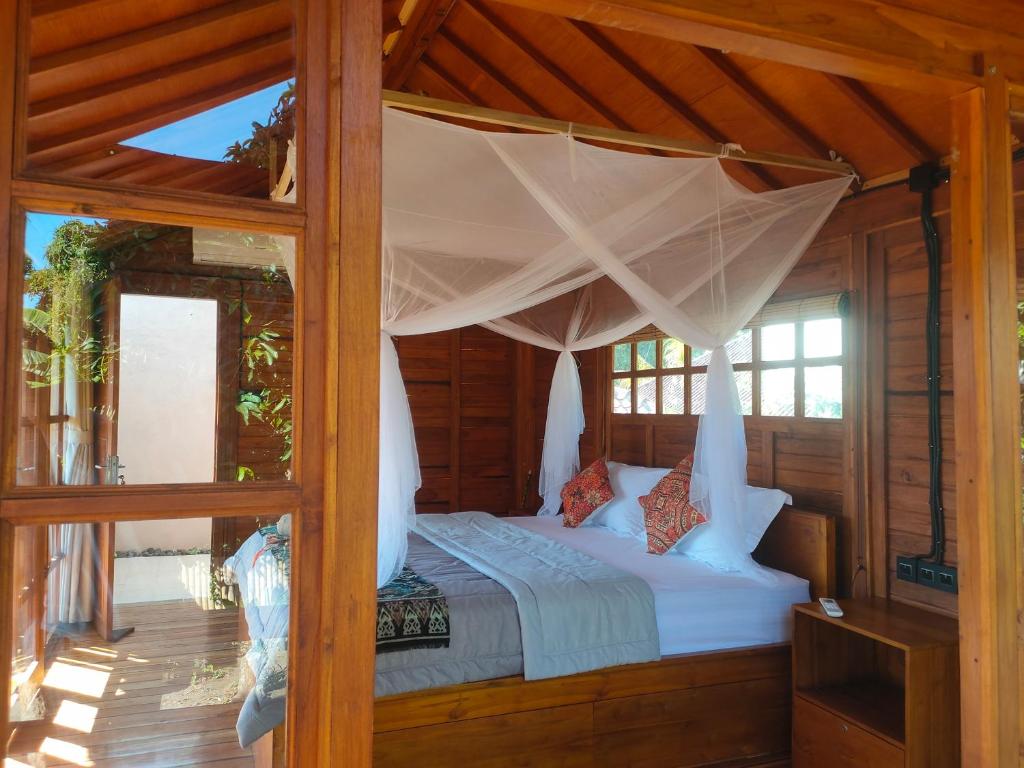 Postel nebo postele na pokoji v ubytování Vanaya Lodge