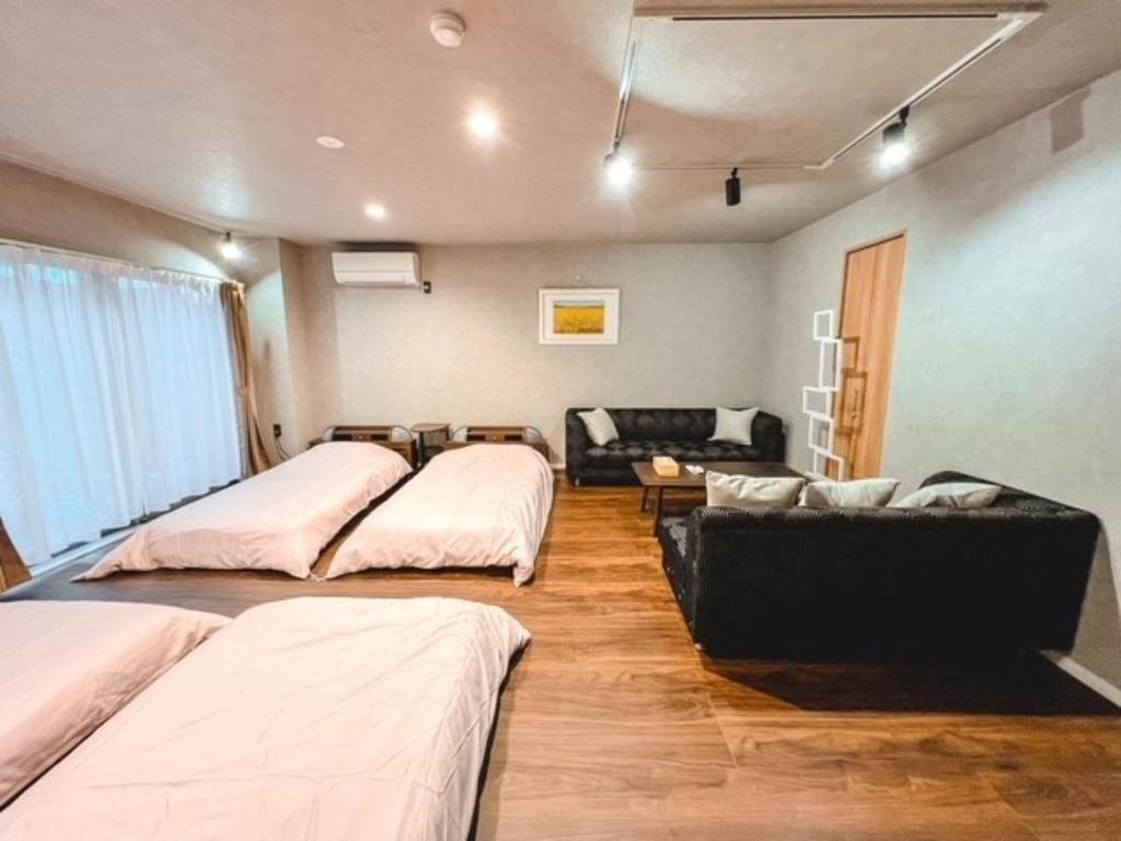 Postel nebo postele na pokoji v ubytování Guest House WA
