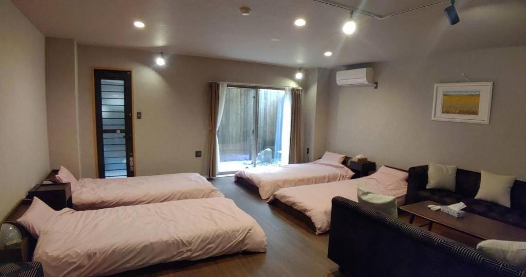 Postel nebo postele na pokoji v ubytování Guest House WA