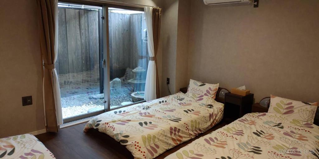 Postel nebo postele na pokoji v ubytování Guest House WA