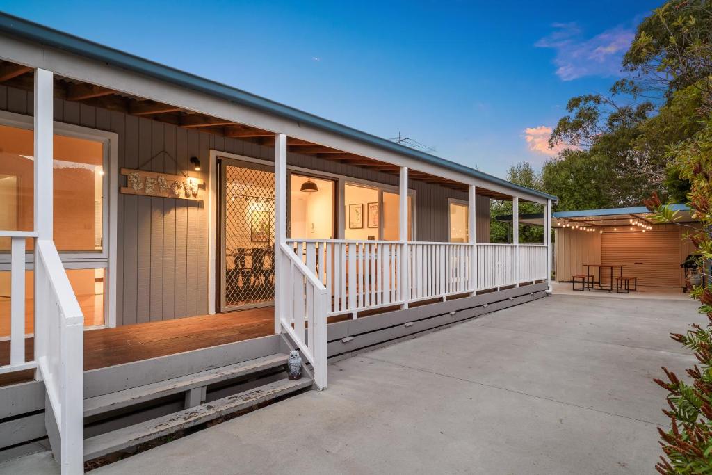 a front porch of a house with a deck at Retreat on Red Rocks in Cowes