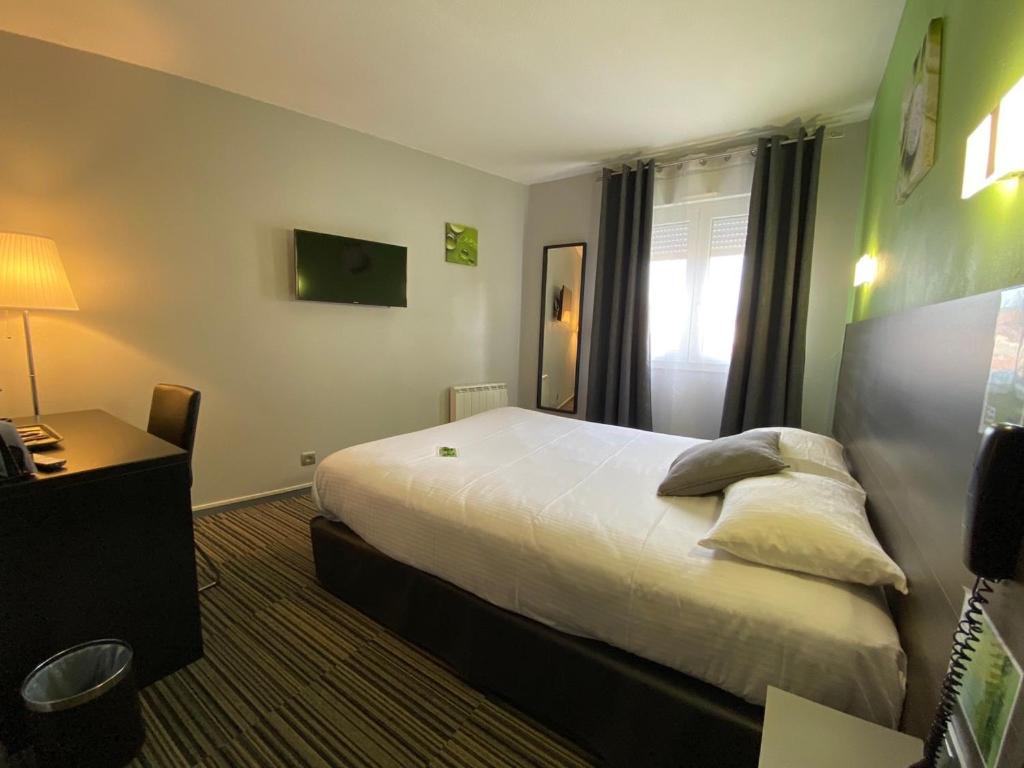 Postel nebo postele na pokoji v ubytování Hôtel Bagatelle