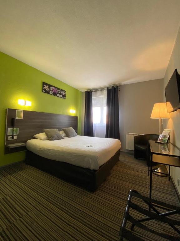 Postel nebo postele na pokoji v ubytování Hôtel Bagatelle