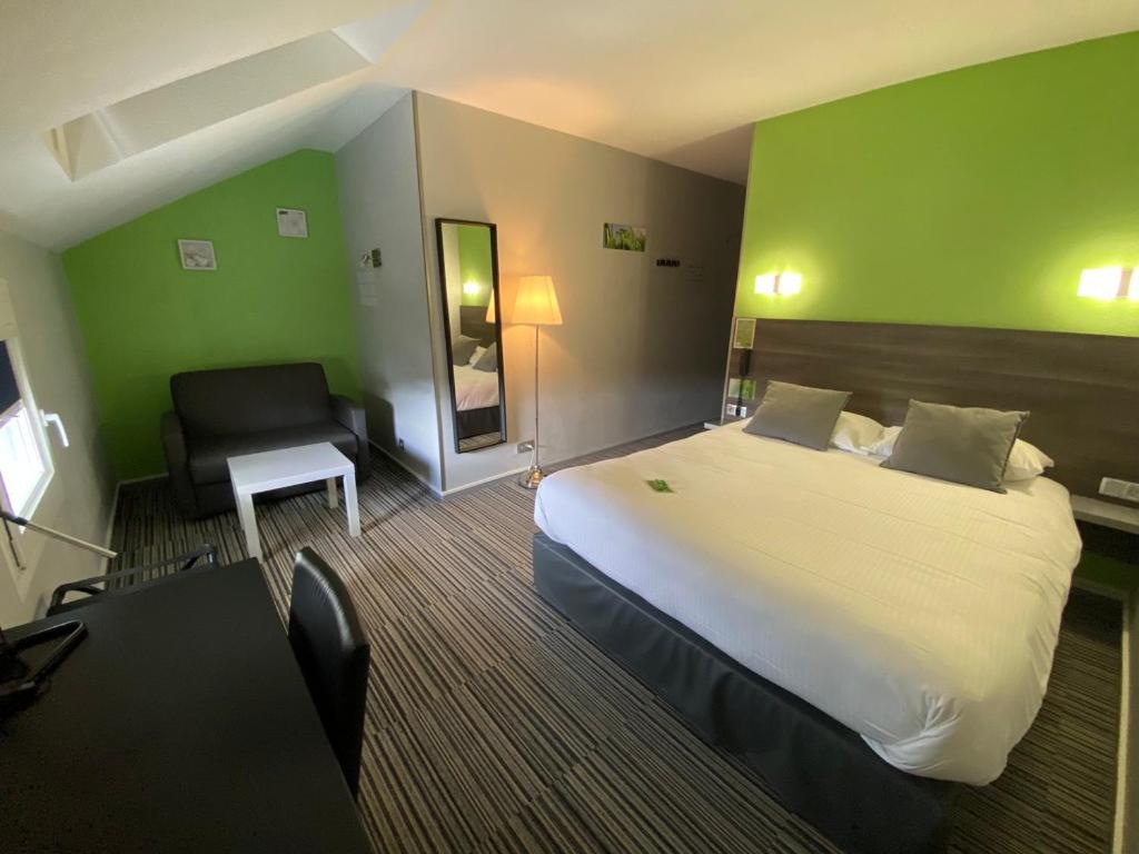 Postel nebo postele na pokoji v ubytování Hôtel Bagatelle