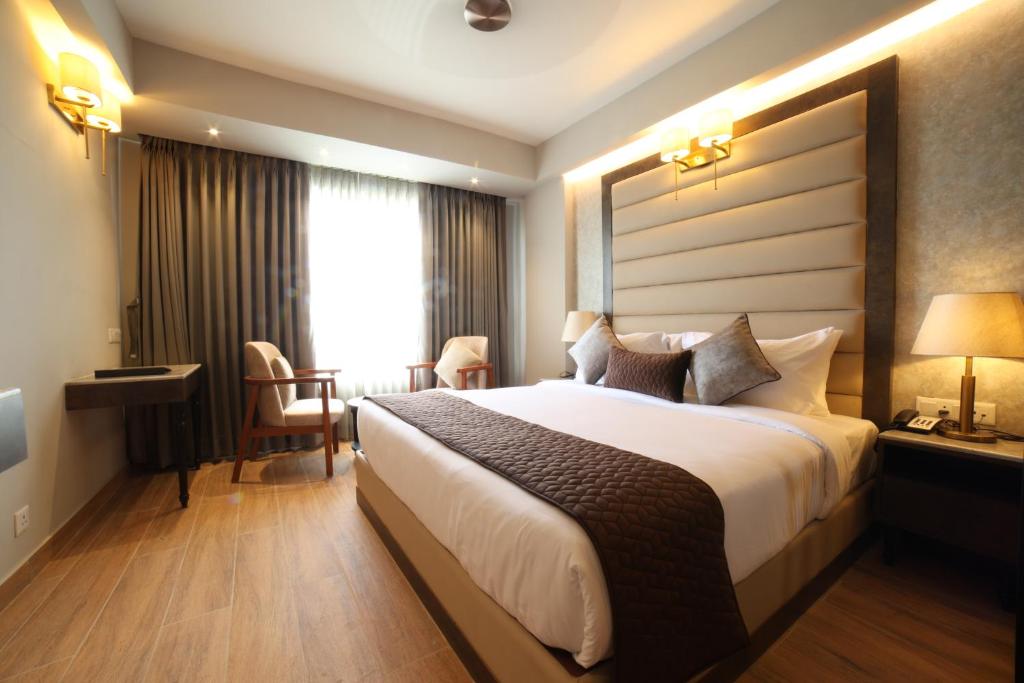 Postel nebo postele na pokoji v ubytování Northin Hotel