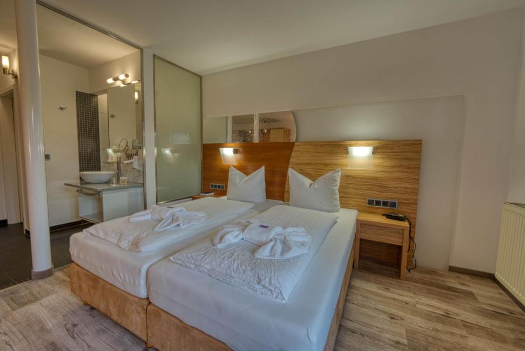 Postel nebo postele na pokoji v ubytování Hotel & SPA Reibener-Hof